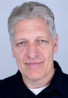 Clancy Brown / Pastor Kingsman